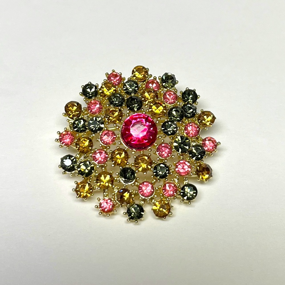 Brooch- Vintage Round with multi colors of rhinestones. NIP, 
Approx 1.25” diam